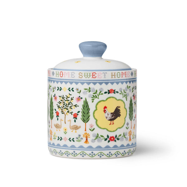 Decorative ceramic jar with chicken design and 'Home Sweet Home' text on a white background