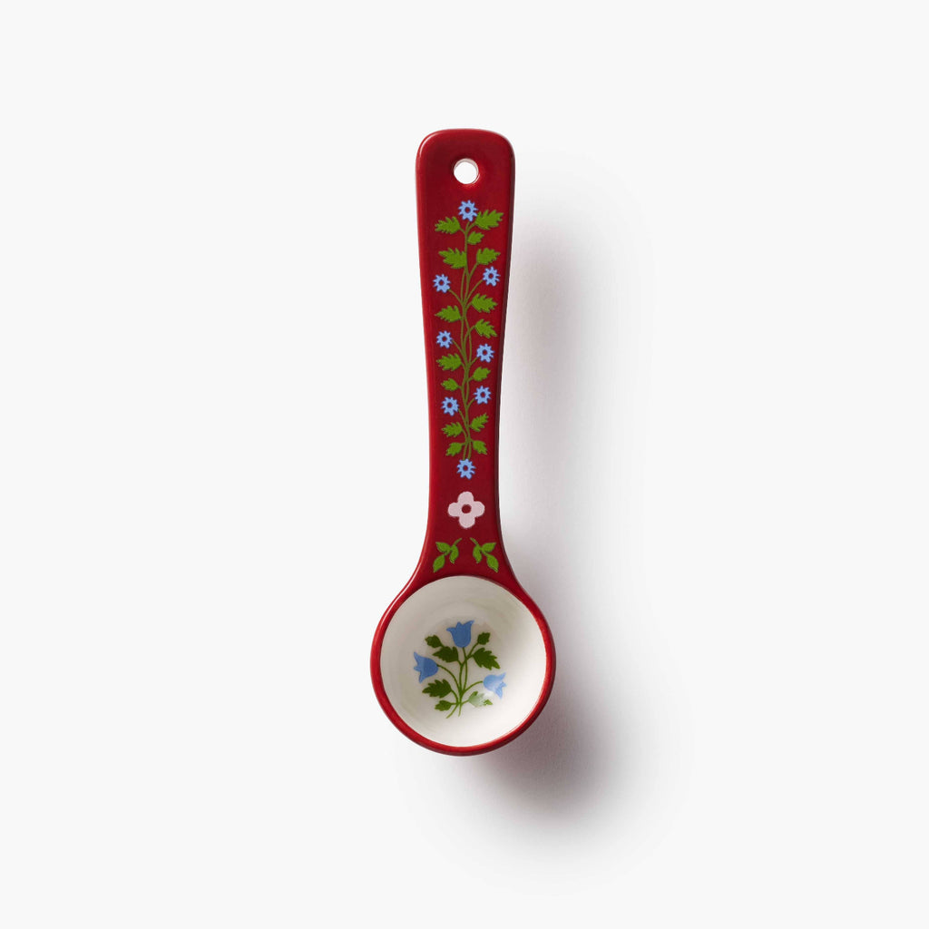 Decorative spoon with floral design on a white background