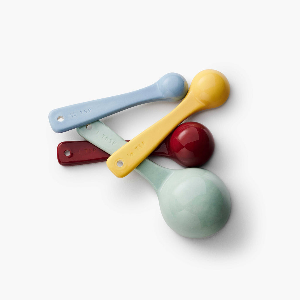 Set of colorful measuring spoons on a white background