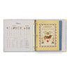 Open recipe book with colorful cover and text on a white background