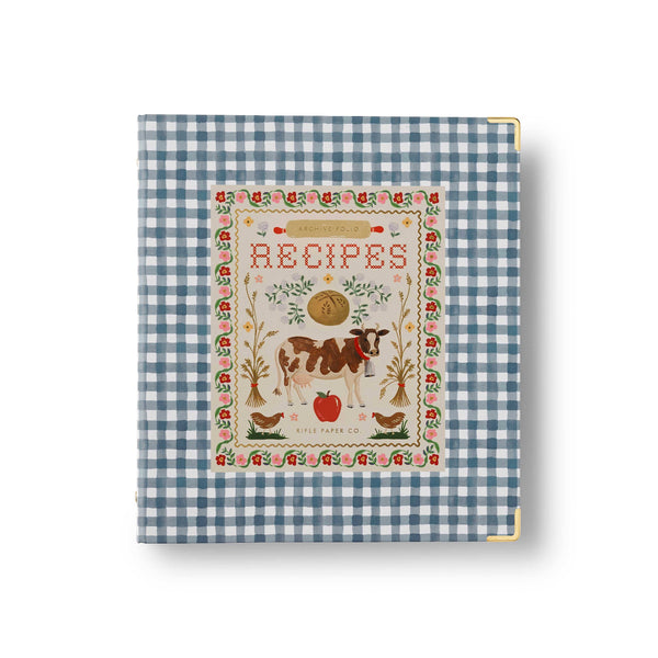 Recipe book with a cow illustration on a blue and white checkered background