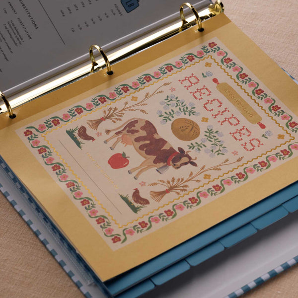 Decorative page with a deer illustration and text in a ring-bound notebook