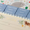 Recipe binder with labeled tabs on a floral background