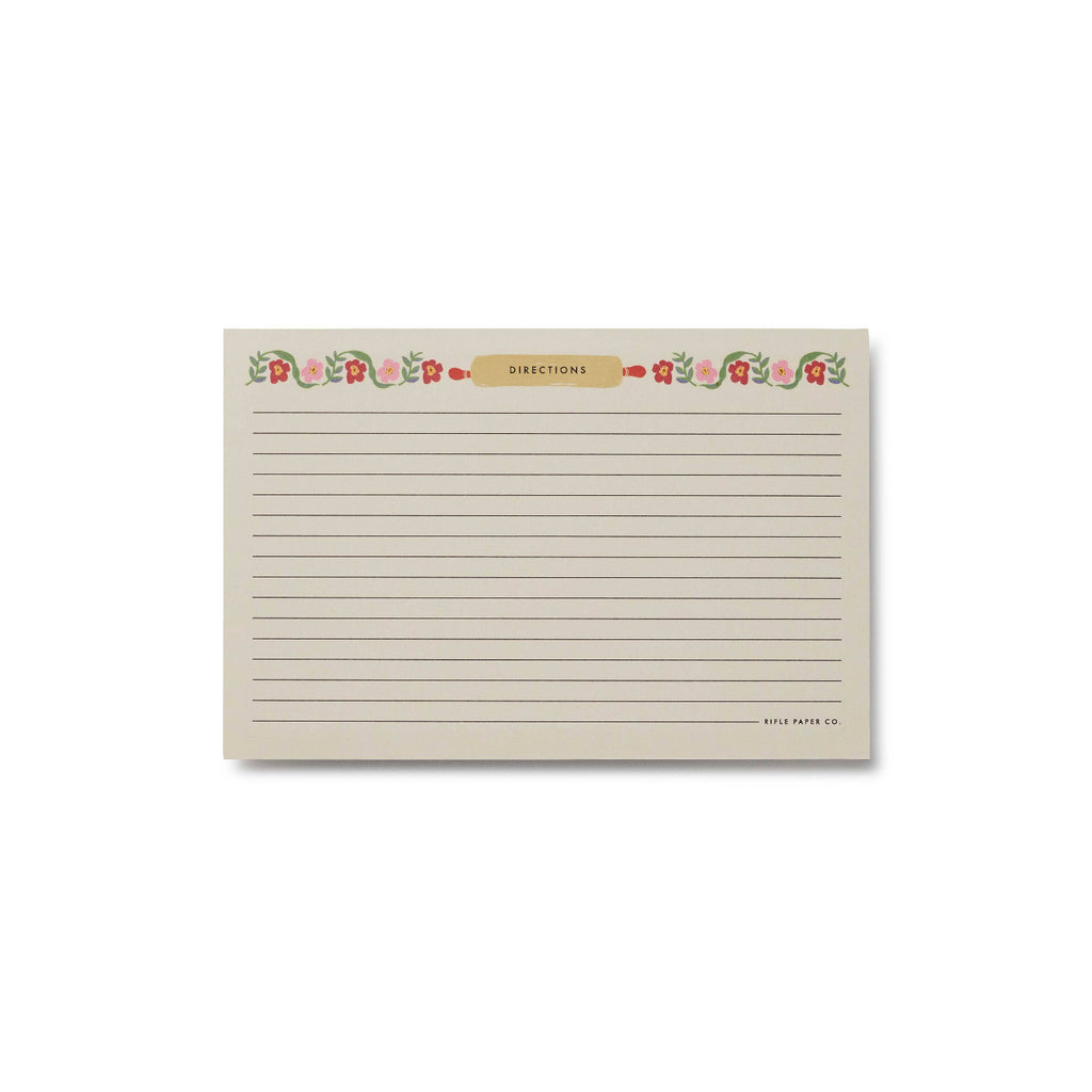 Rectangular notepad with floral design and text on a white background