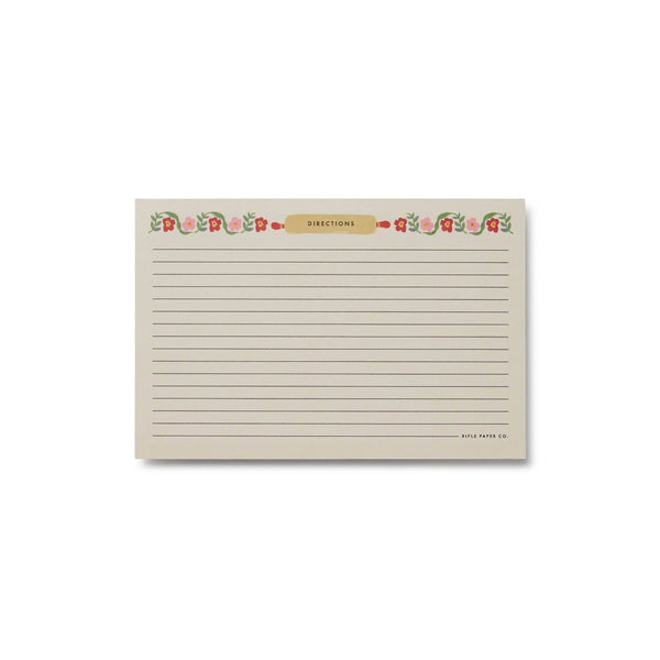 Rectangular notepad with floral design and text on a white background