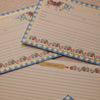 Set of recipe cards with decorative borders on a wooden surface