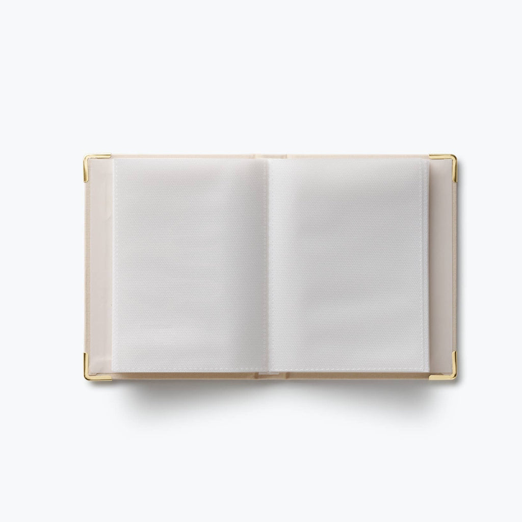 Open notebook with white pages on a white background