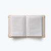 Open notebook with white pages on a white background