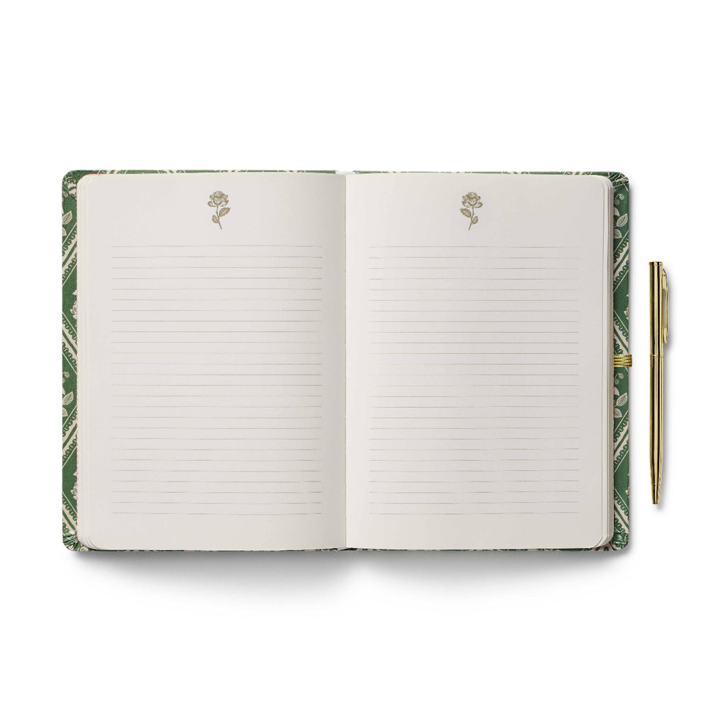 Open notebook with green marbled cover and pen on a white background