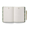 Open notebook with green marbled cover and pen on a white background
