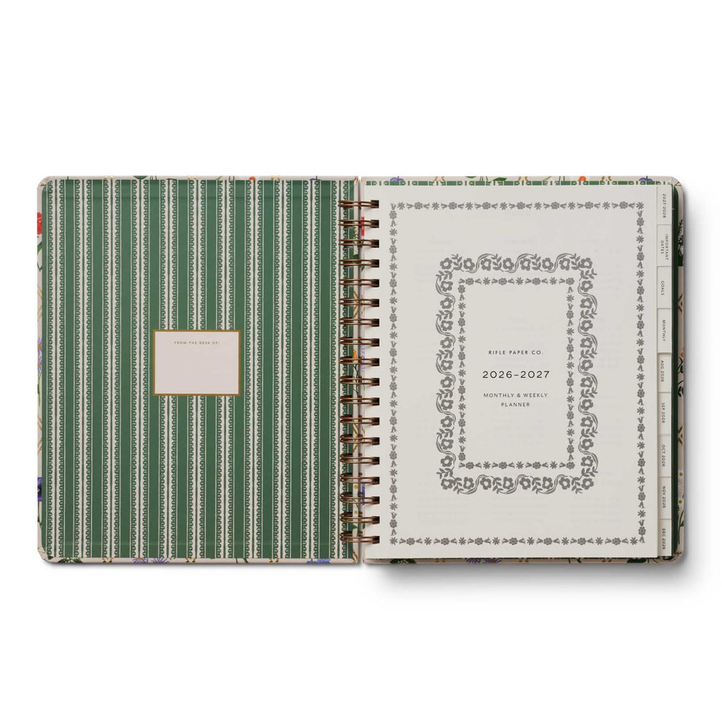 Green striped planner with decorative cover on a white background