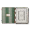 Green striped planner with decorative cover on a white background