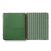 Open notebook with green cover and striped interior on a white background
