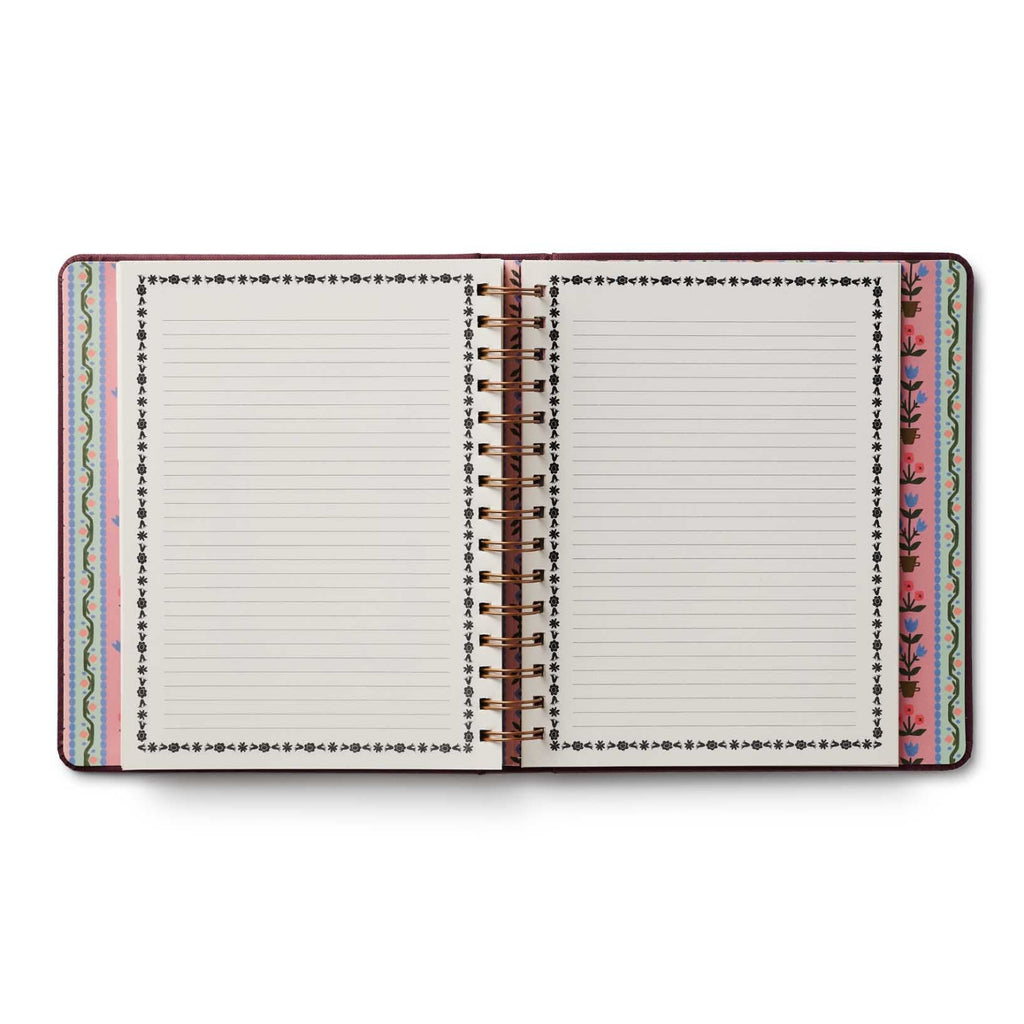 Open notebook with colorful边际设计 on a white background