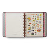 Open planner with colorful stickers on a white background
