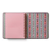 Notebook with pink cover and patterned spine on a white background