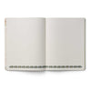 Open notebook with lined pages on a white background
