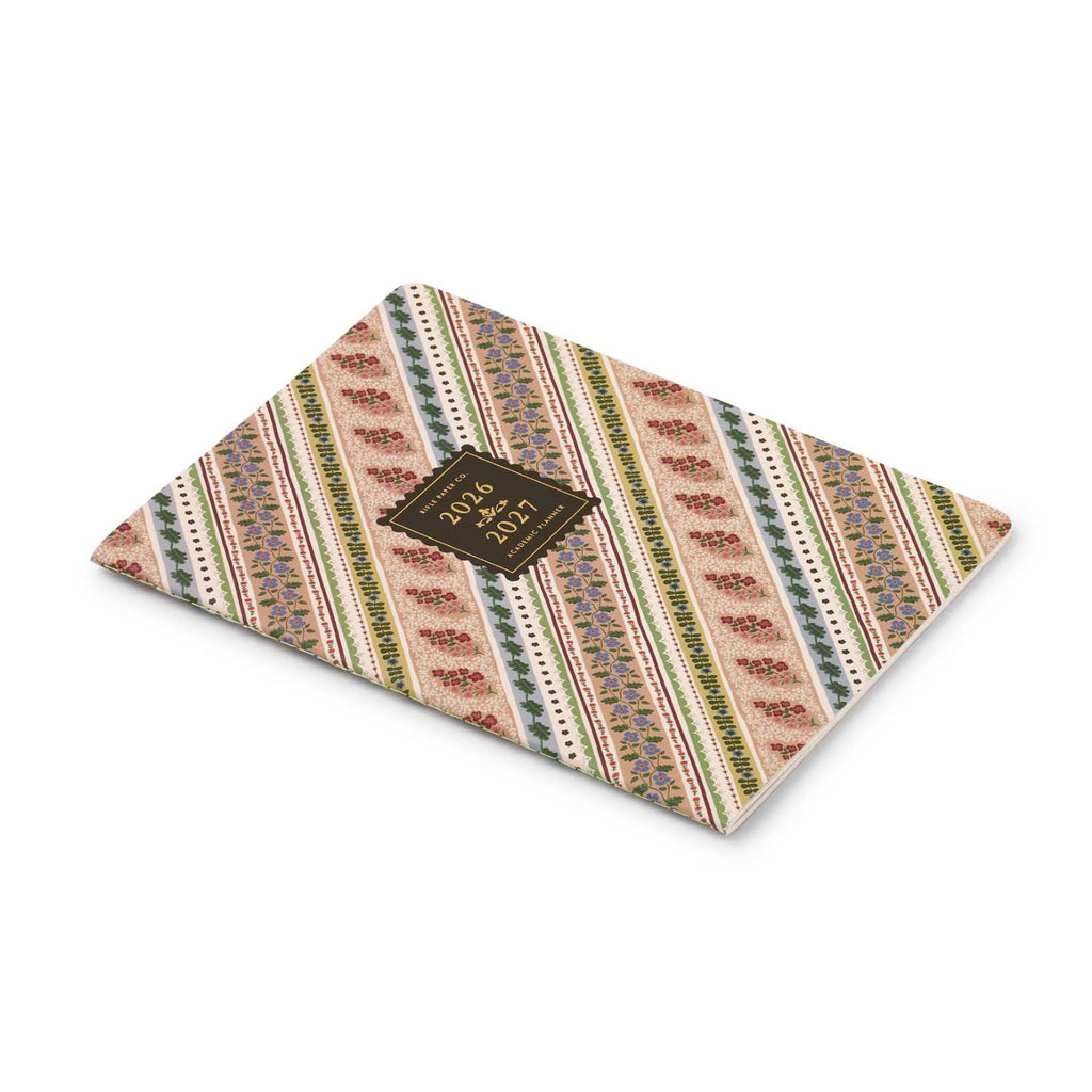 Patterned triangle-shaped product with a brand label on a white background