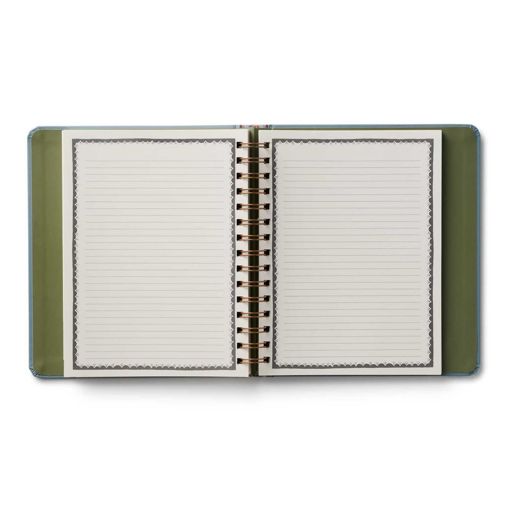 Open notebook with green cover on a white background
