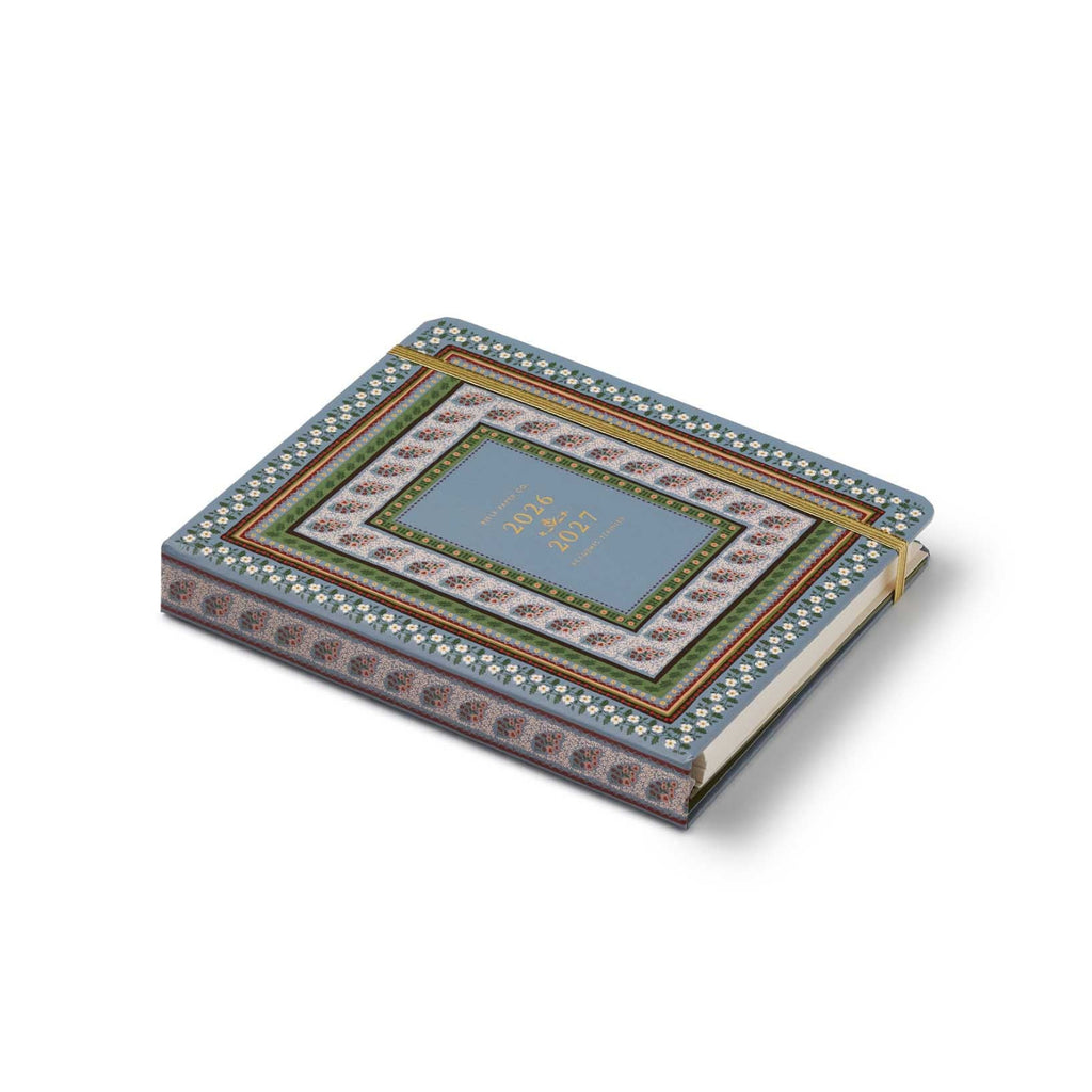 Decorative notebook with intricate patterns on a white background