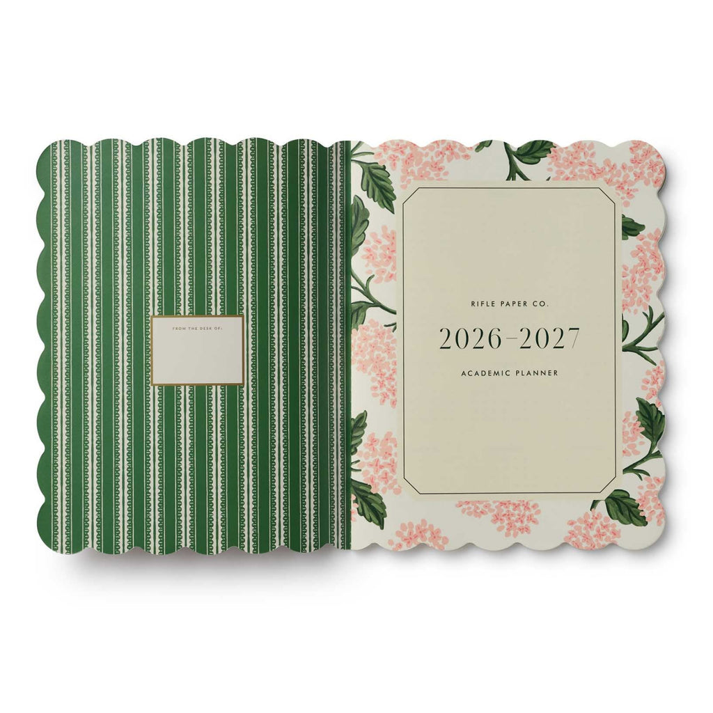 Planner with green striped and floral design on a white background