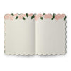 Open notebook with floral design on the cover on a white background