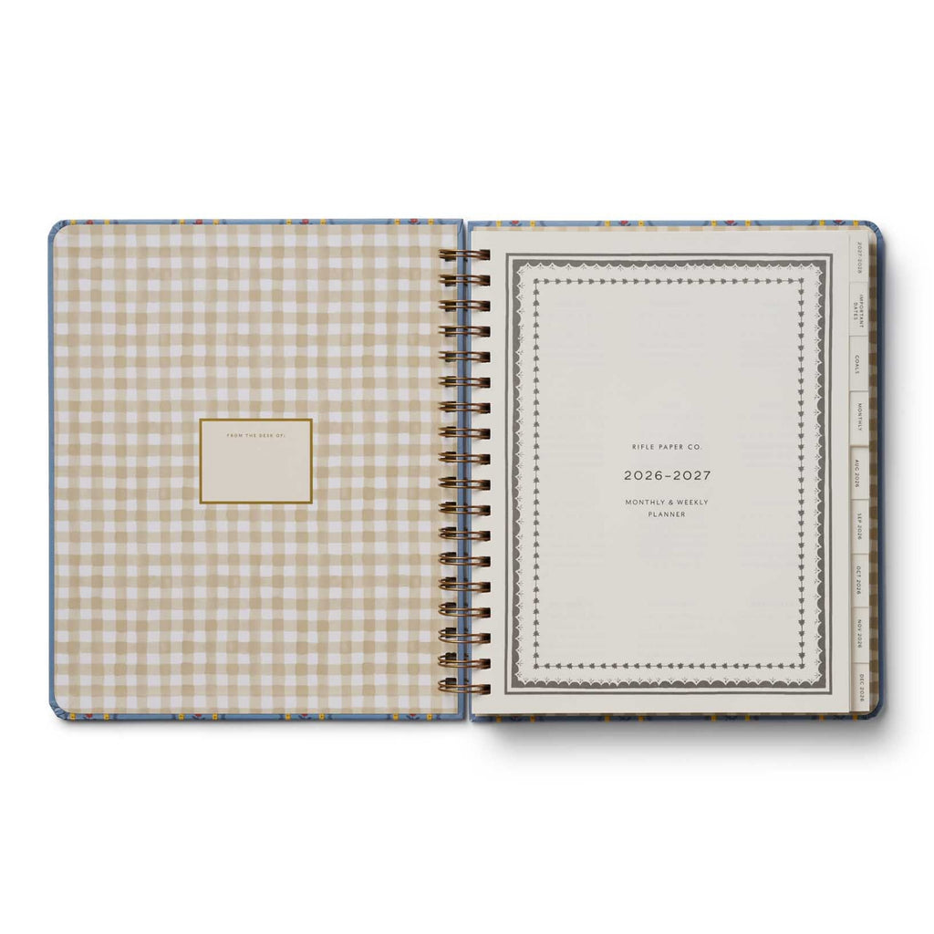 Open planner with gingham cover and plain back on a white background
