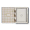 Open planner with gingham cover and plain back on a white background