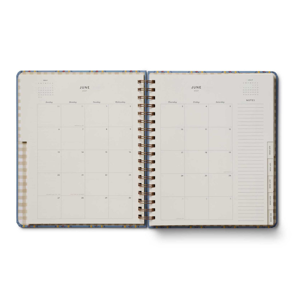 Open planner showing a monthly layout on two pages with a decorative border.