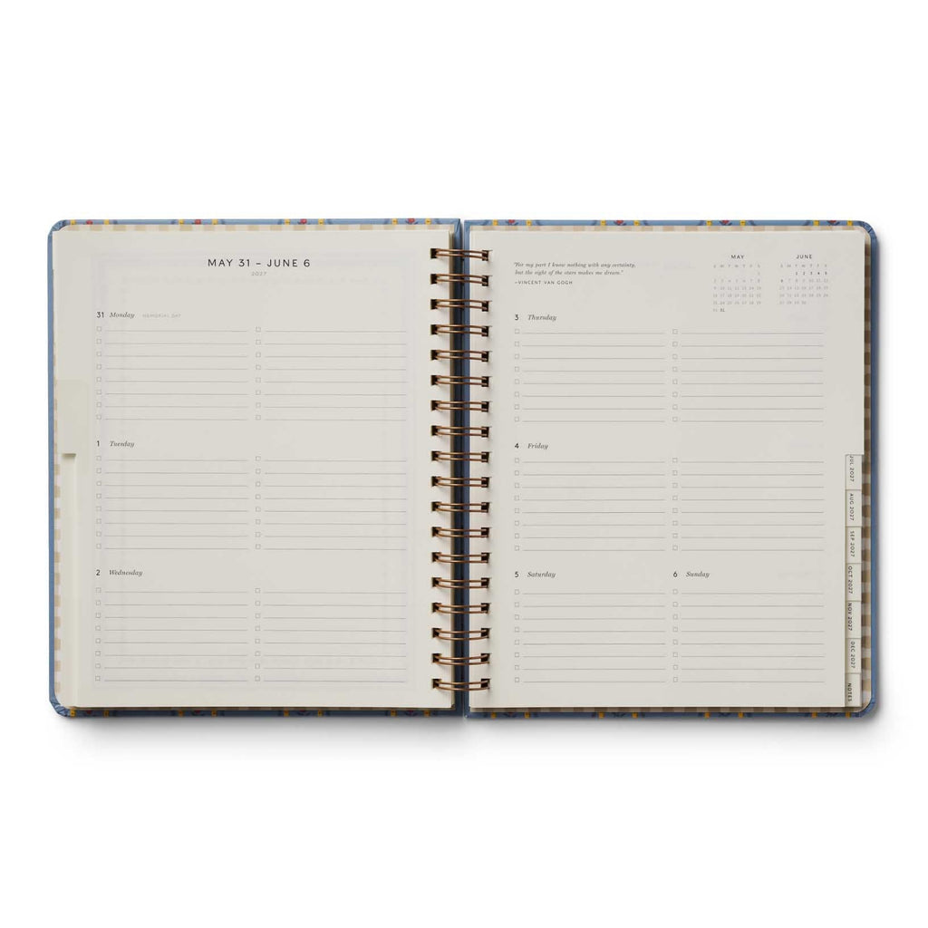 Open planner with daily schedule and notes on a white background