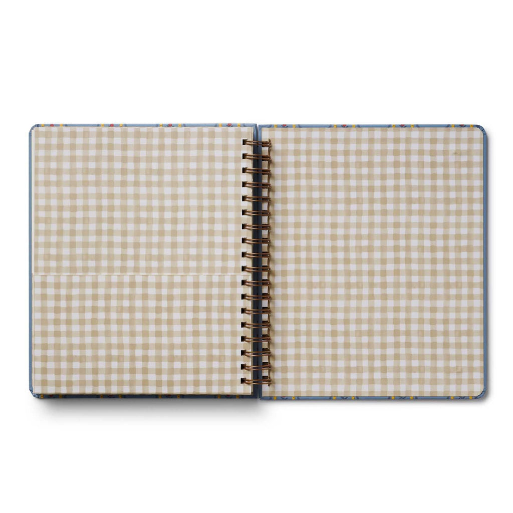 Open notebook with checkered pages on a white background