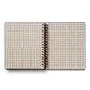 Open notebook with checkered pages on a white background