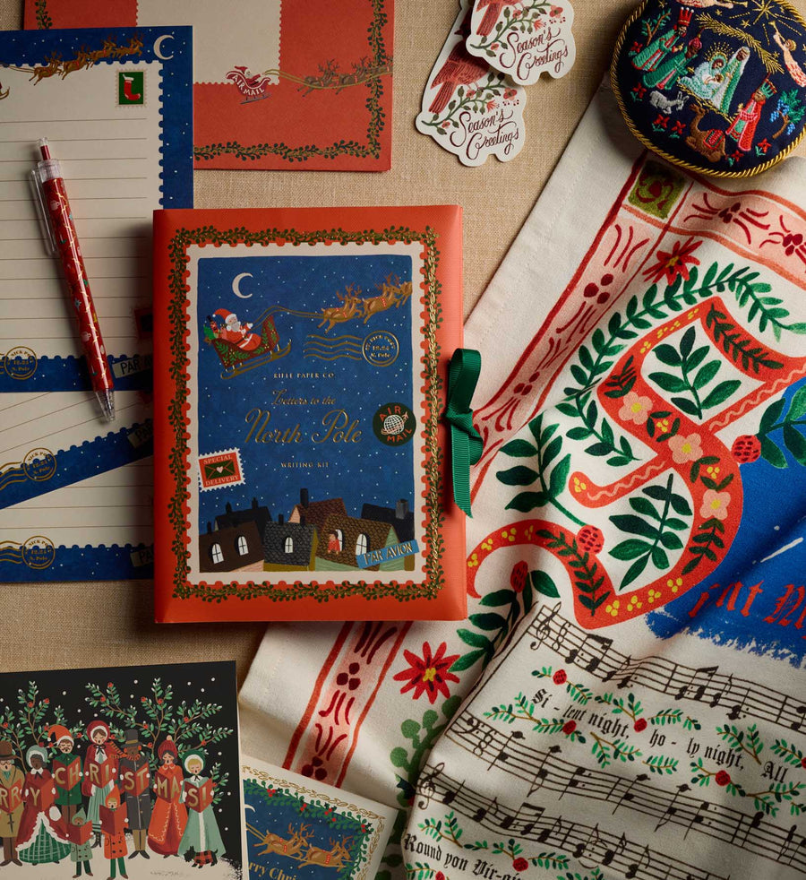 Decorative book with festive design on a tablecloth with Christmas-themed elements