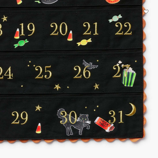 Halloween-themed hanging countdown calendar with gold numbers and festive illustrations.