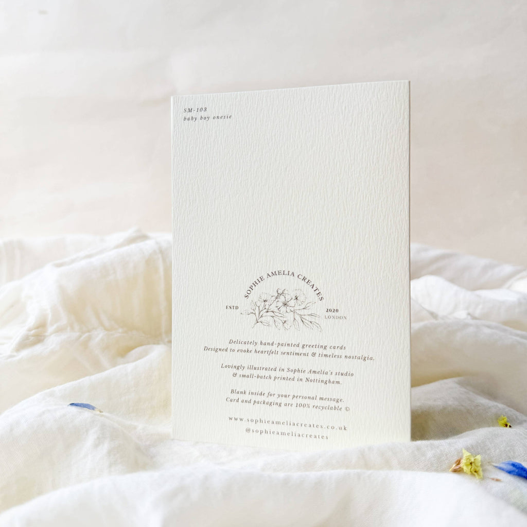 White card with text and design on a white surface