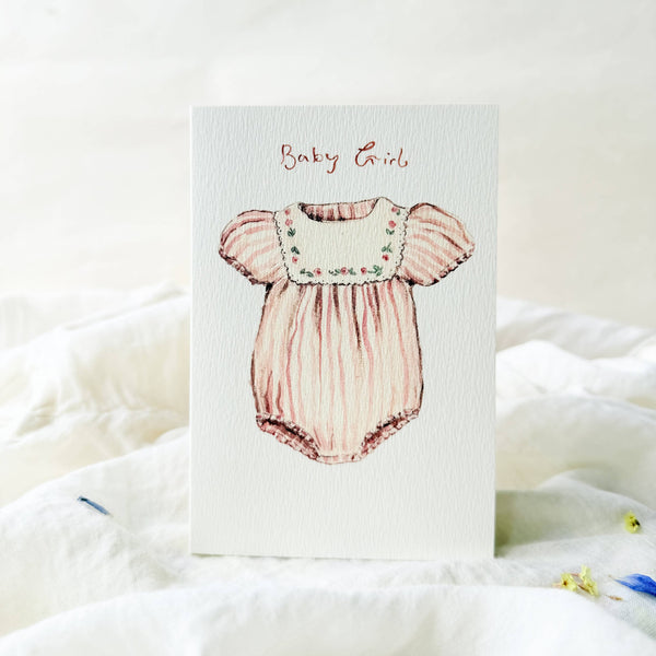 Card with a pink baby dress illustration and 'Baby Girl' text on a white background