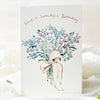 Greeting card with blue flowers and a pink ribbon on a white background