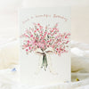 Greeting card with pink floral design and 'Have a beautiful Birthday' text on a white background.