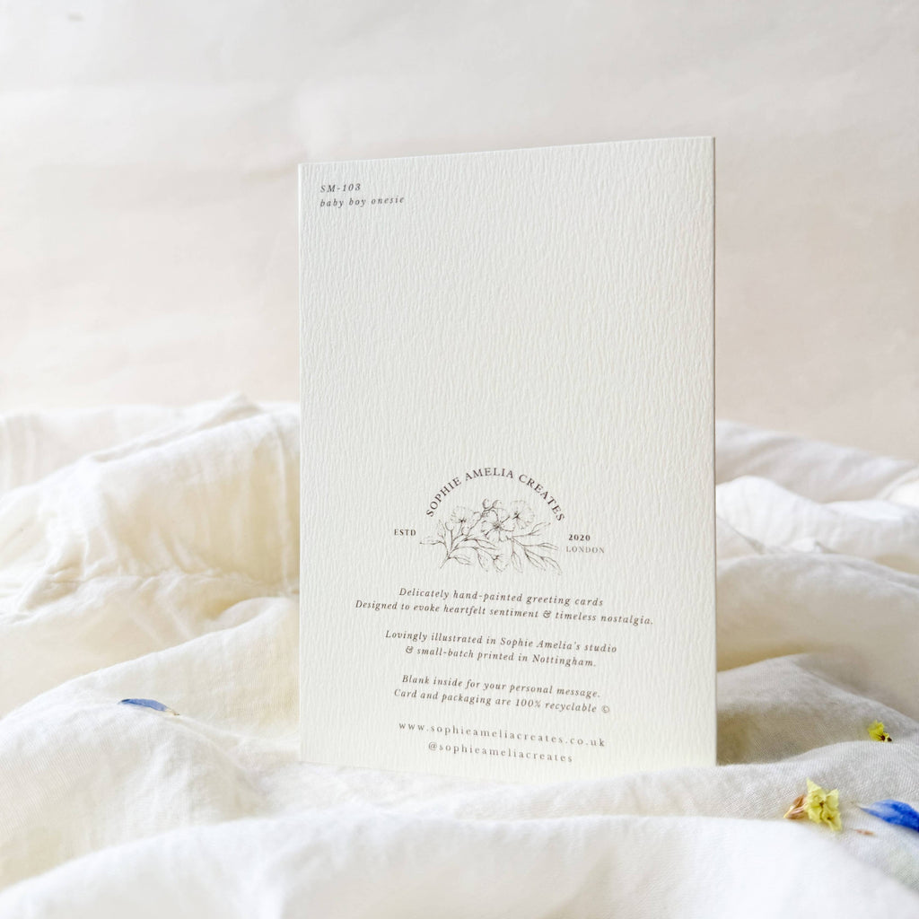 White card with text and design on a white surface
