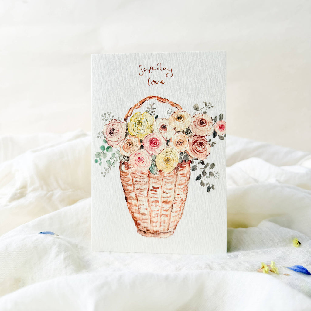 Card with floral design and text on a white surface