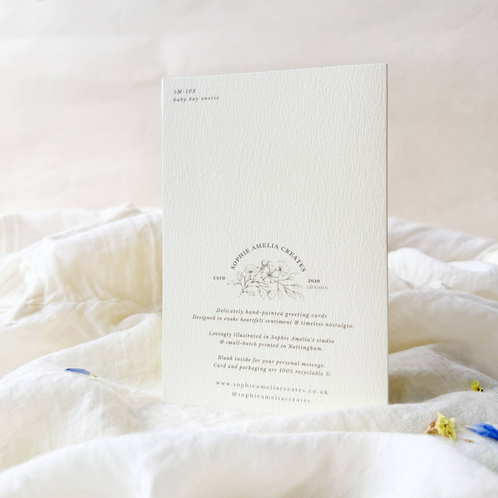 White card with text and design on a white surface