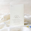 White card with text and design on a white surface