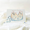 Card with a birthday crown illustration on a white background