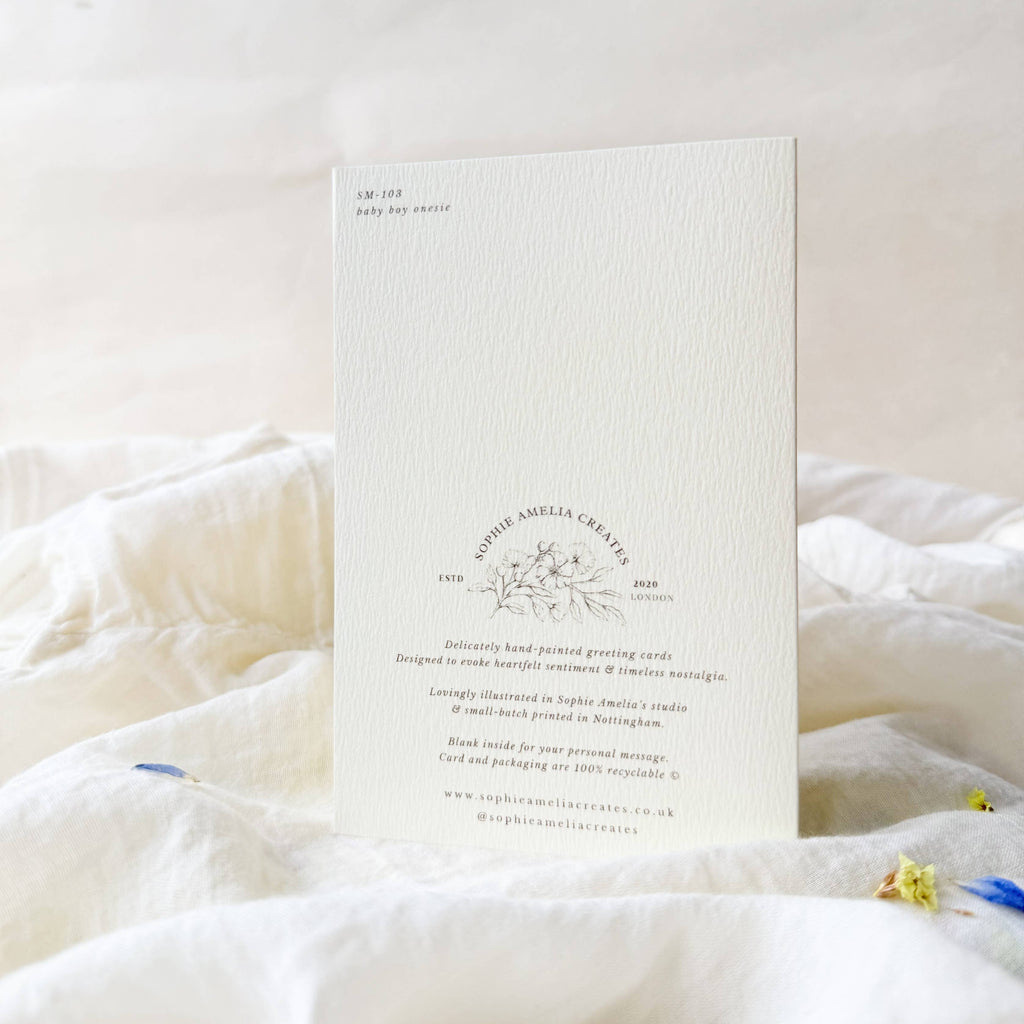 White card with text and design on a white surface