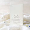 White card with text and design on a white surface