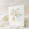 Greeting card with floral design and 'Happy Anniversary' text on a soft white background