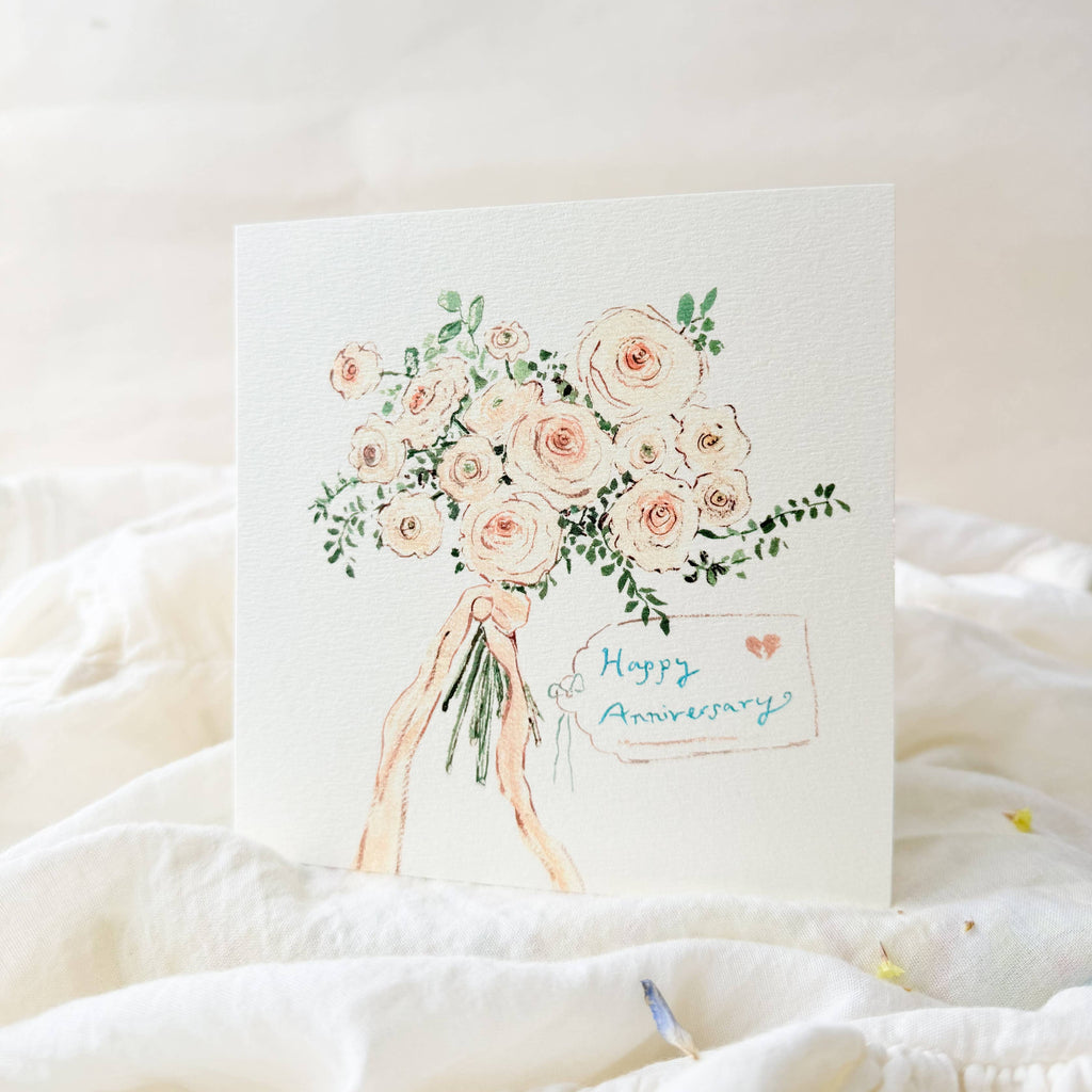 Card with floral illustration and 'Happy Anniversary' text on a soft white background