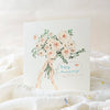 Card with floral illustration and 'Happy Anniversary' text on a soft white background