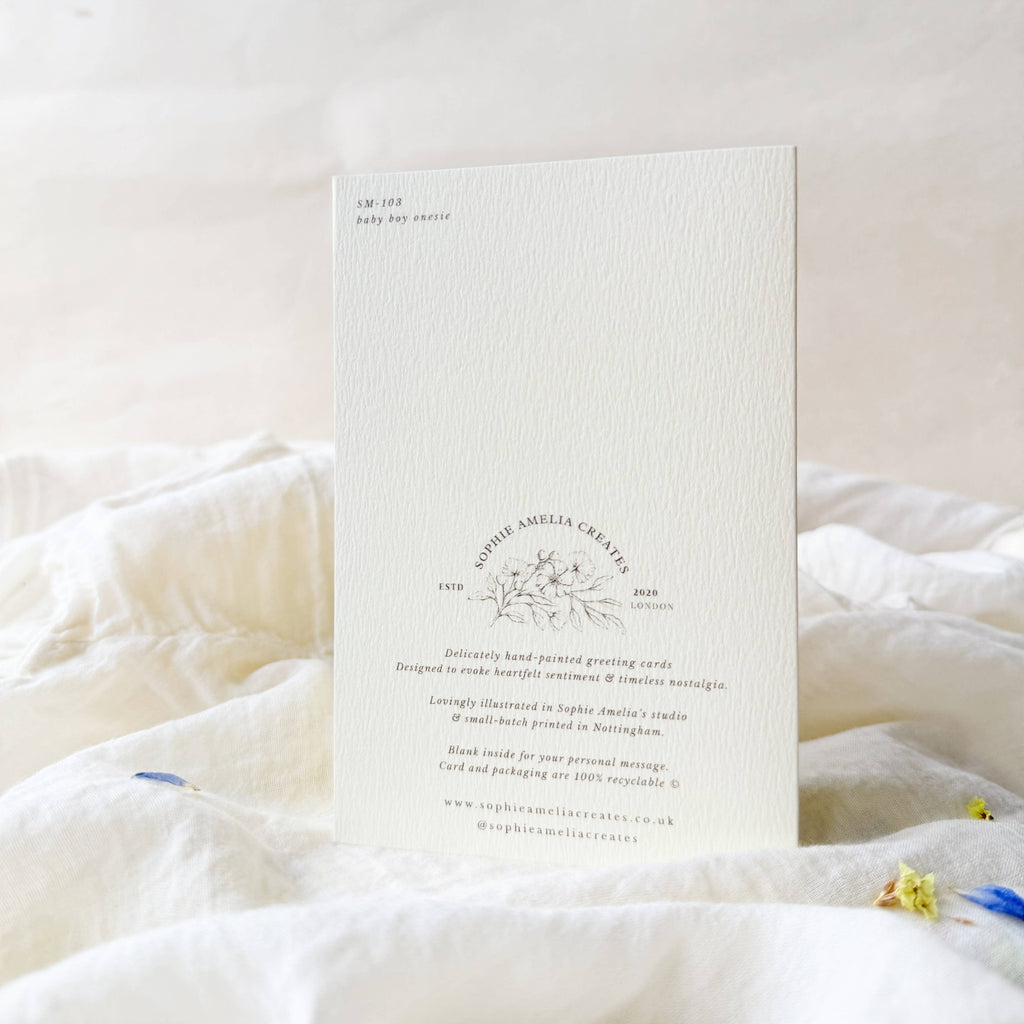 White card with text and design on a white surface