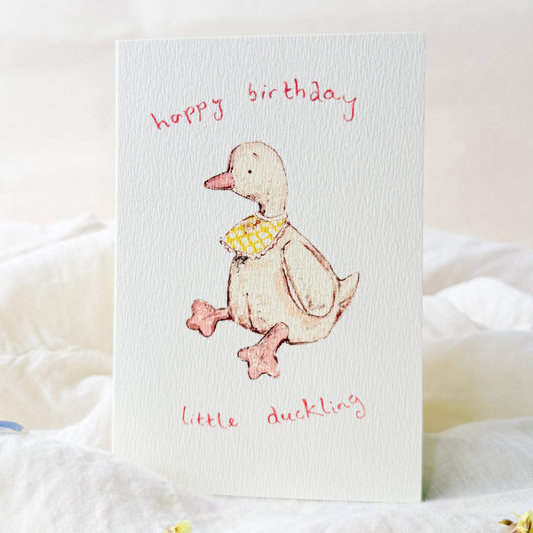 Birthday card with a duck illustration and 'Happy Birthday little duckling' text on a white background.